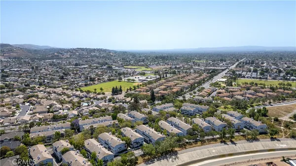 an aerial view of a city with lots of residential buildings
