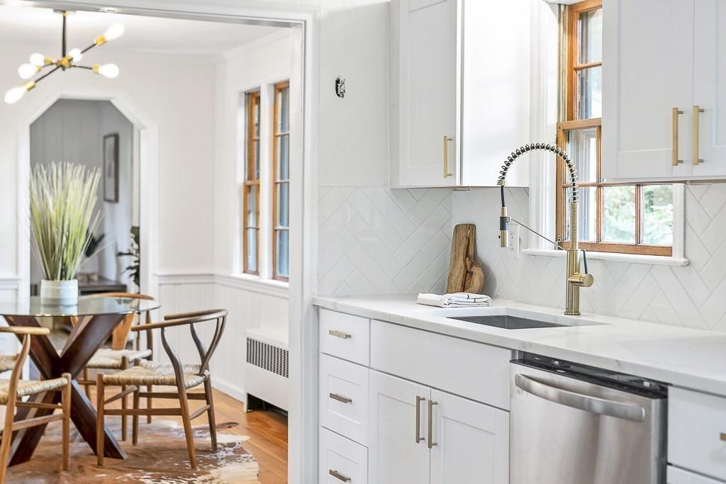 93 Meadowbrook Road Needham, MA 02492 - Photo 11 of 34 a kitchen with a sink cabinets and window