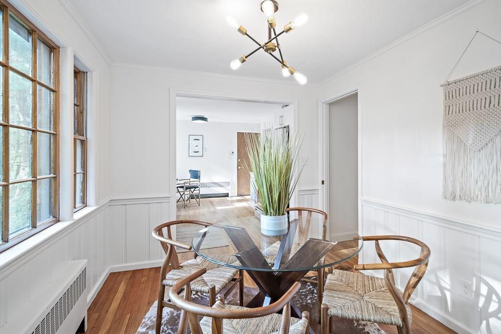 93 Meadowbrook Road Needham, MA 02492 - Photo 12 of 34 a view of a dining room with furniture and a potted plant