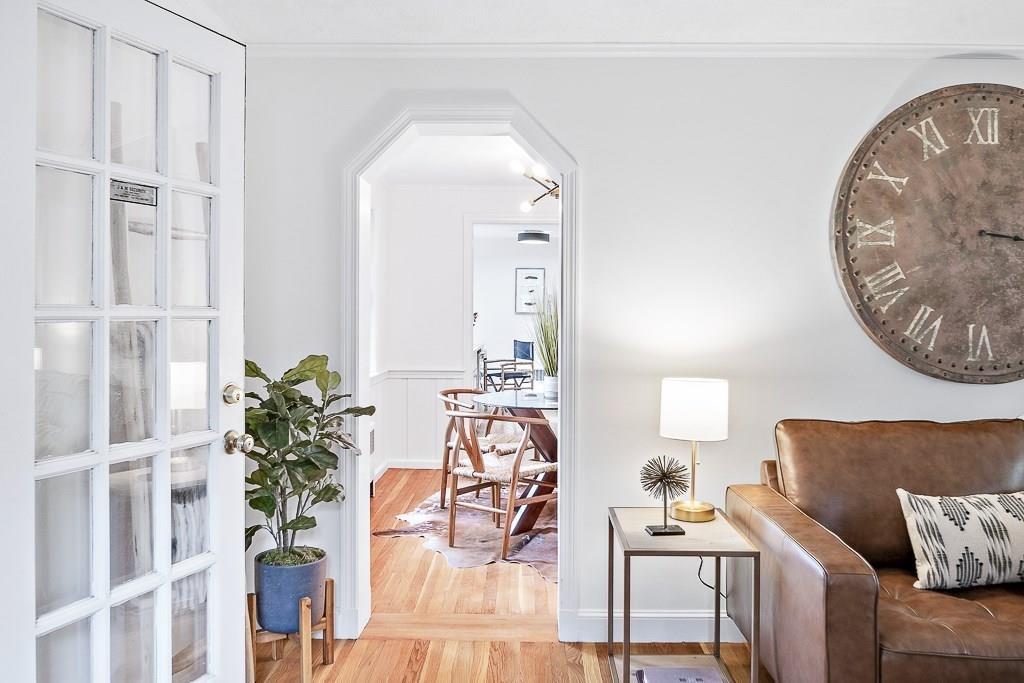 93 Meadowbrook Road Needham, MA 02492 - Photo 14 of 34 a living room with furniture and a chandelier
