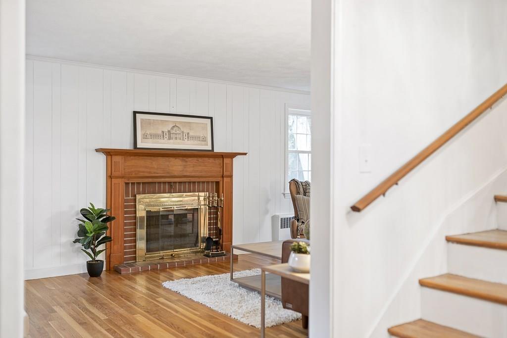 93 Meadowbrook Road Needham, MA 02492 - Photo 16 of 34 a living room with furniture and a fireplace