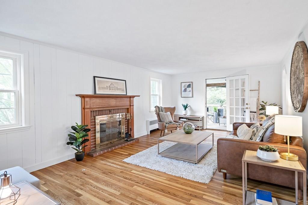 93 Meadowbrook Road Needham, MA 02492 - Photo 17 of 34 a living room with furniture fireplace and window