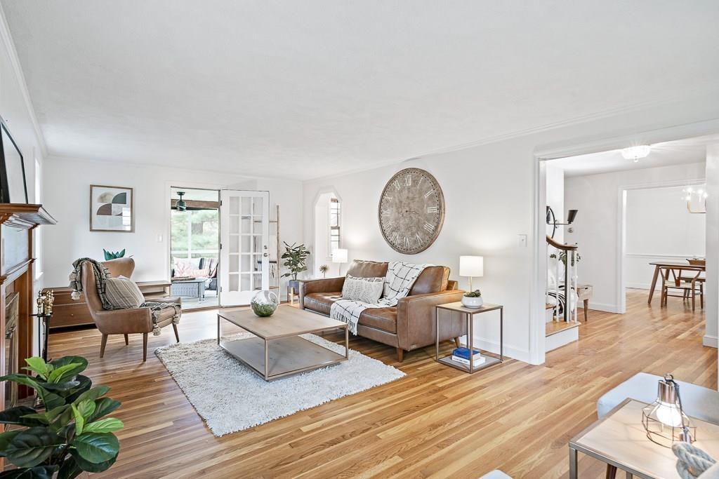 93 Meadowbrook Road Needham, MA 02492 - Photo 18 of 34 a living room with furniture a rug potted plant and a window
