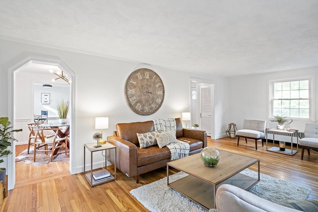 93 Meadowbrook Road Needham, MA 02492 - Photo 20 of 34 a living room with furniture wooden floor and a large window