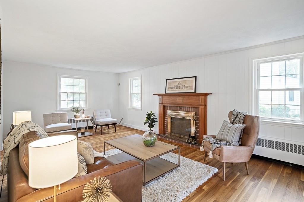 93 Meadowbrook Road Needham, MA 02492 - Photo 22 of 34 a living room with furniture a fireplace and a large window