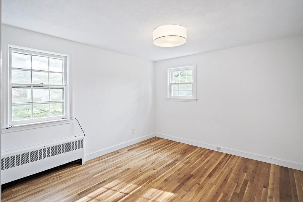 93 Meadowbrook Road Needham, MA 02492 - Photo 27 of 34 a view of a room with wooden floor and windows