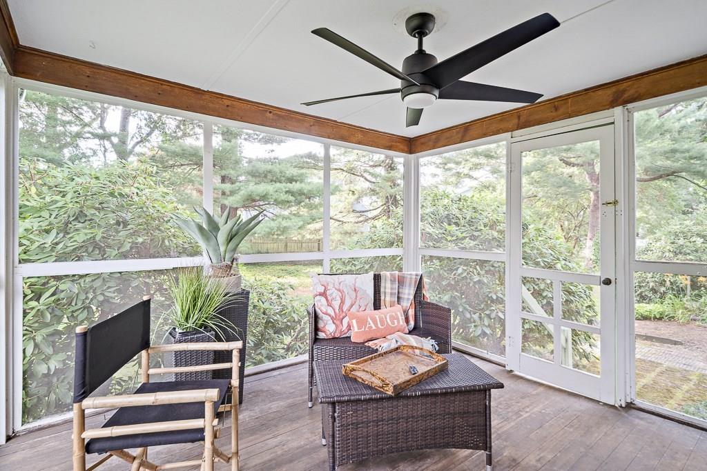 93 Meadowbrook Road Needham, MA 02492 - Photo 32 of 34 a living room with furniture and a large window