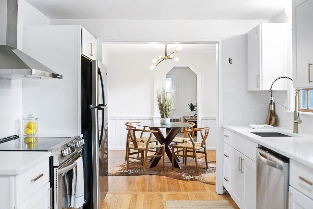 93 Meadowbrook Road Needham, MA 02492 - Photo 9 of 34 a view of a kitchen center island and furniture