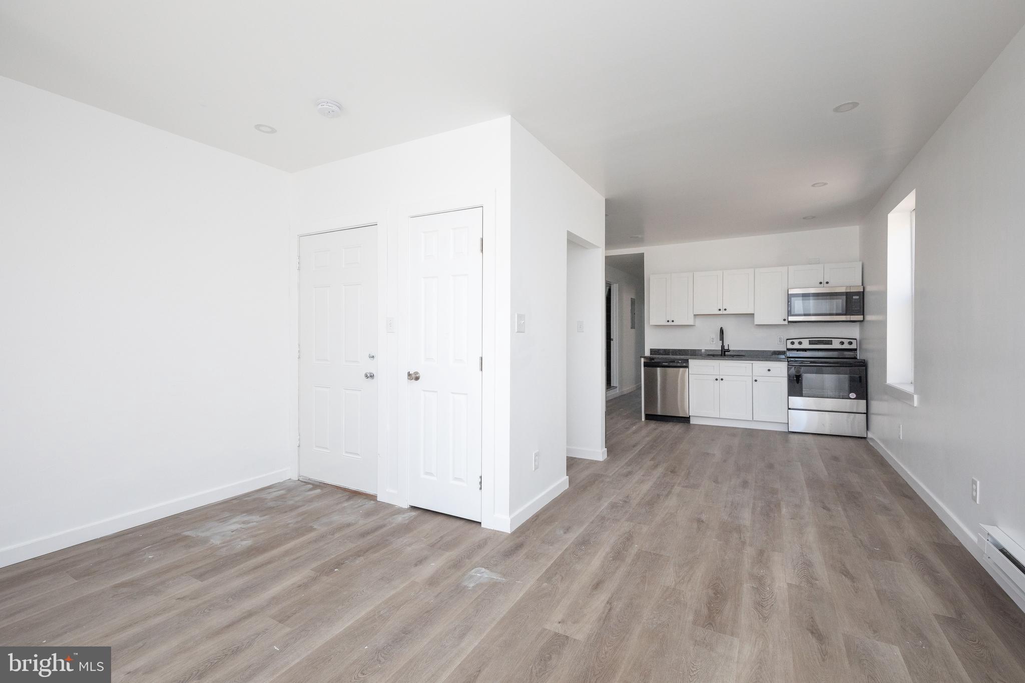 1841 North 33rd Street Philadelphia, PA 19121 - Photo 5 of 29 a view of kitchen with wooden floor