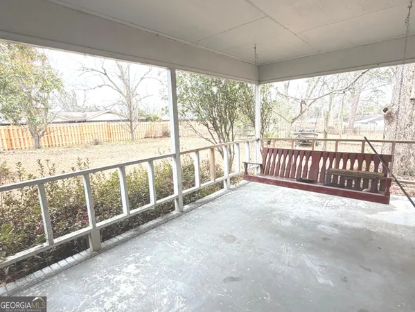 a view of an empty room with a balcony