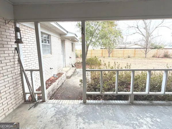 a view of an empty room and a window