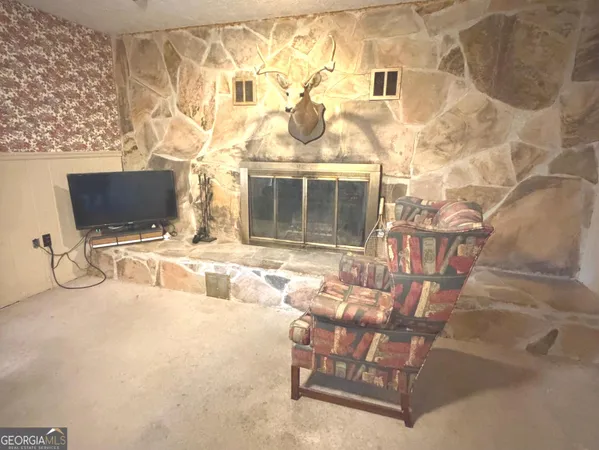 a view of a chairs and table in a backyard