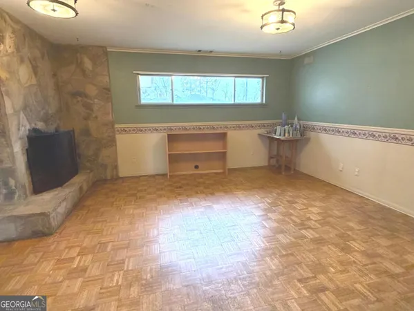 a view of a room with window and cabinet