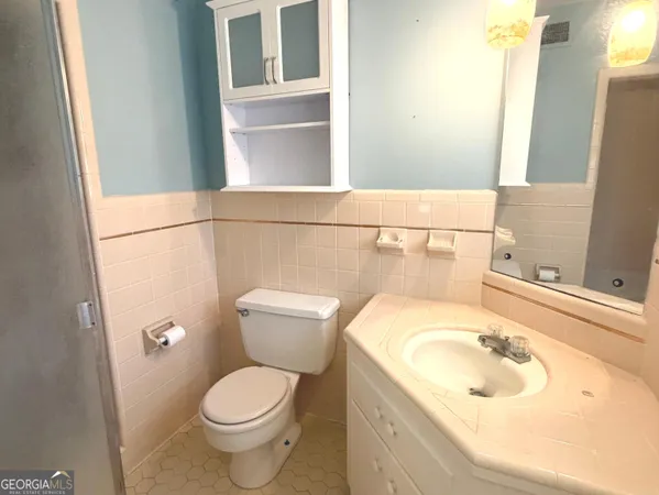 a bathroom with a sink and a toilet