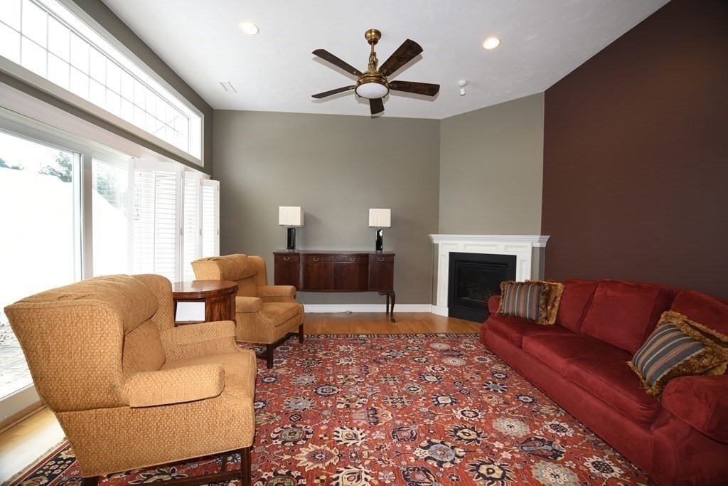 2 Mariner's Drive, Unit 2 (AKA 66) Marshfield, MA 02050 - Photo 12 of 41 a living room with furniture a fireplace and a large window