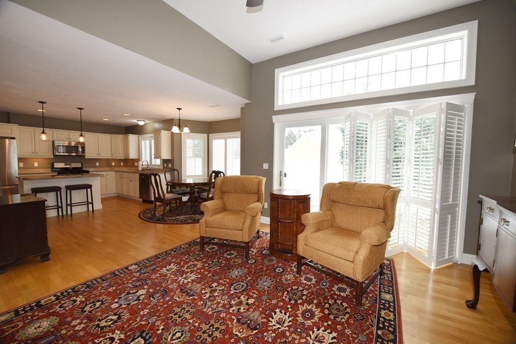 2 Mariner's Drive, Unit 2 (AKA 66) Marshfield, MA 02050 - Photo 13 of 41 a living room with furniture and a table