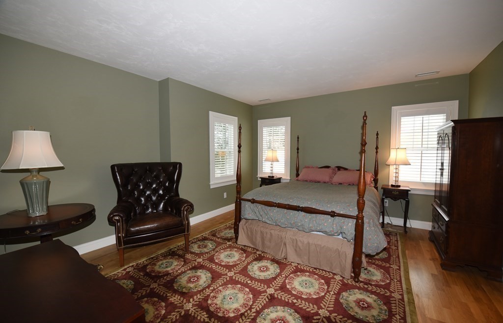 2 Mariner's Drive, Unit 2 (AKA 66) Marshfield, MA 02050 - Photo 24 of 41 a bedroom with a bed and a lamp on table