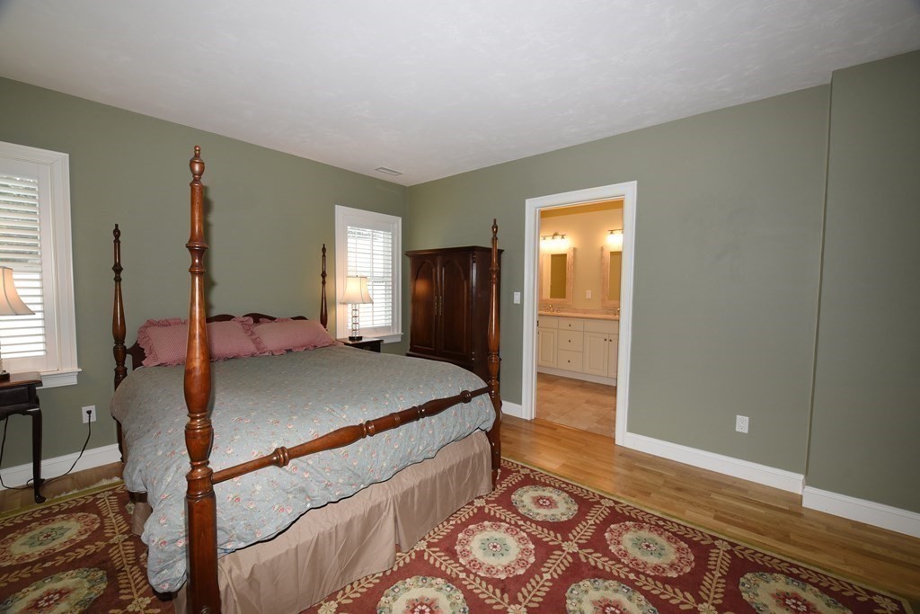 2 Mariner's Drive, Unit 2 (AKA 66) Marshfield, MA 02050 - Photo 25 of 41 a bed room with a bed and furniture