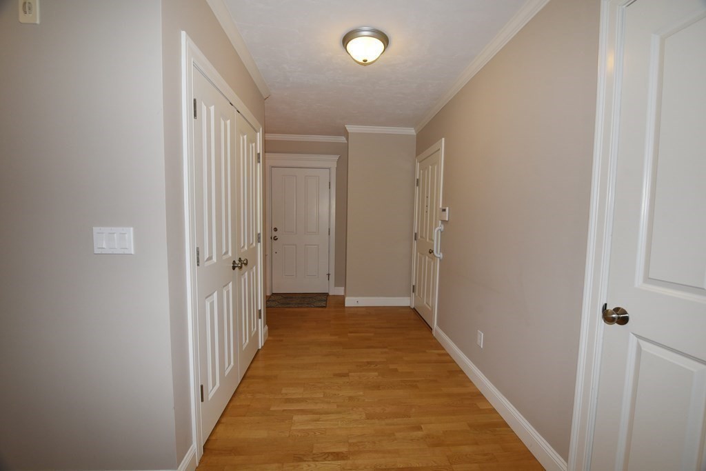 2 Mariner's Drive, Unit 2 (AKA 66) Marshfield, MA 02050 - Photo 26 of 41 a view of a hallway with a wooden floor