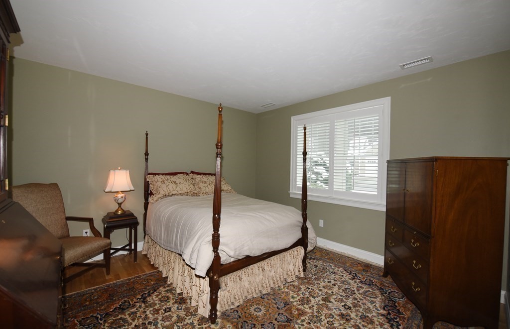 2 Mariner's Drive, Unit 2 (AKA 66) Marshfield, MA 02050 - Photo 27 of 41 a bedroom with a bed and a table in it