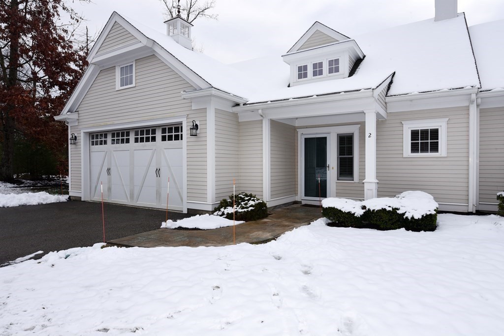 2 Mariner's Drive, Unit 2 (AKA 66) Marshfield, MA 02050 - Photo 3 of 41 a front view of a house with a yard and garage