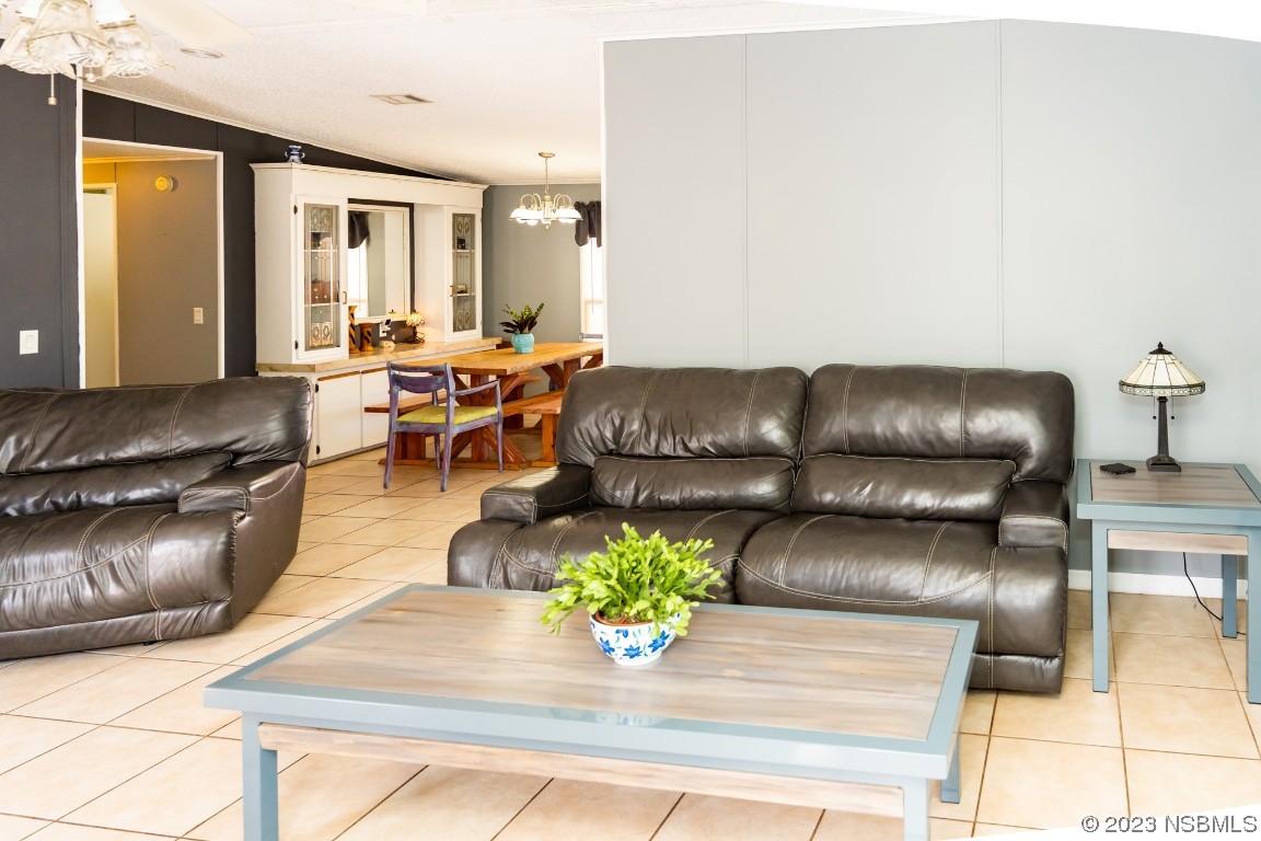 106 Charles Street Edgewater, FL 32141 - Photo 15 of 89 a living room with furniture and wooden floor