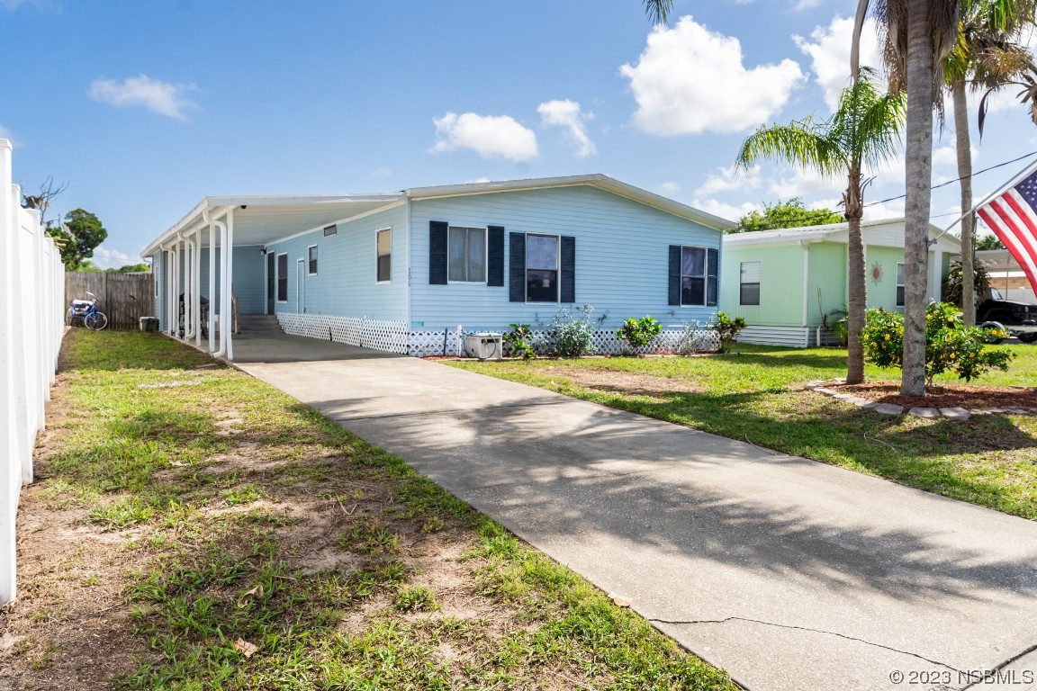 106 Charles Street Edgewater, FL 32141 - Photo 2 of 89 a view of a house with swimming pool and a yard