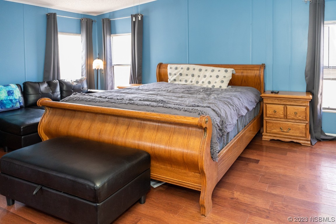 106 Charles Street Edgewater, FL 32141 - Photo 30 of 89 a bedroom with a bed and window