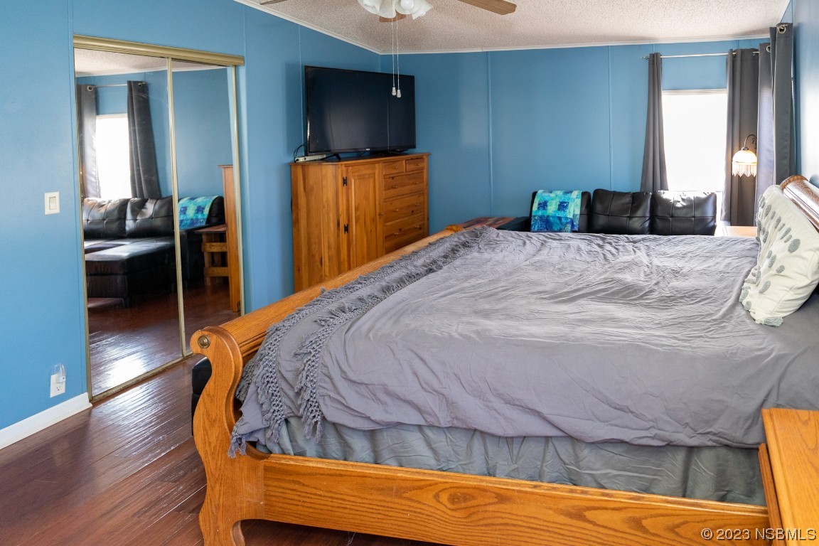 106 Charles Street Edgewater, FL 32141 - Photo 31 of 89 a bedroom with a bed and a flat screen tv