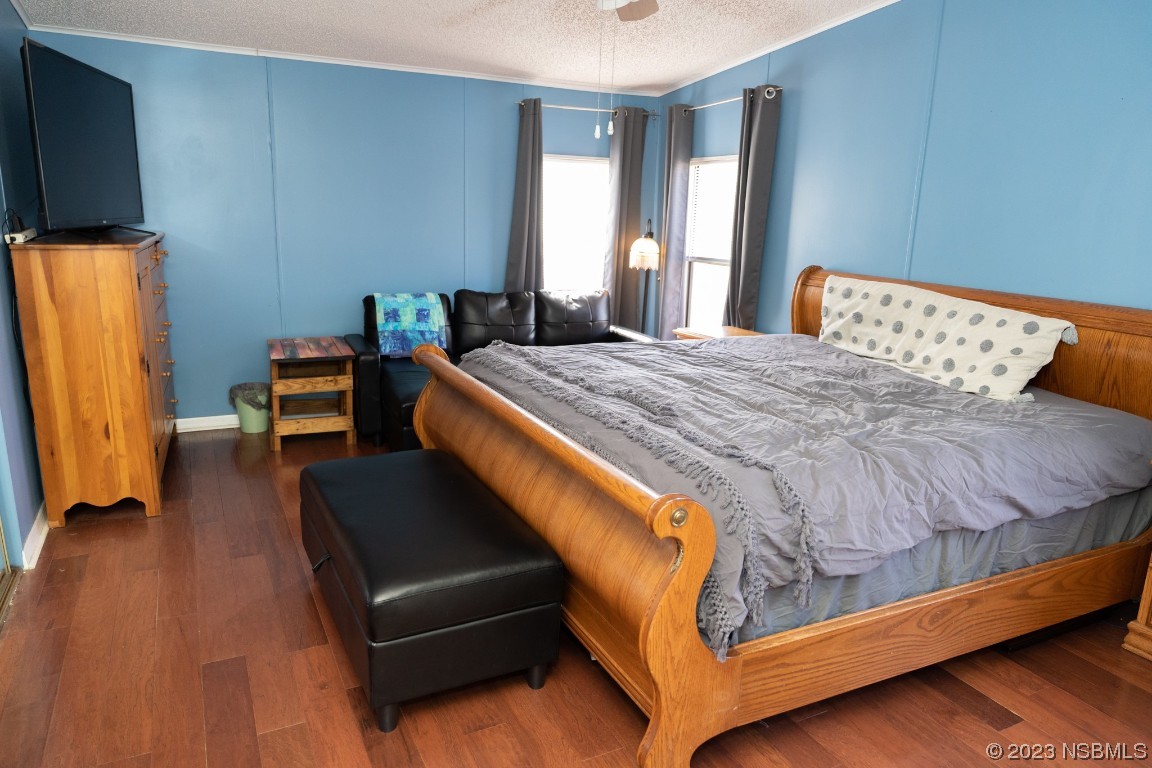 106 Charles Street Edgewater, FL 32141 - Photo 35 of 89 a bed room with a bed and a chair