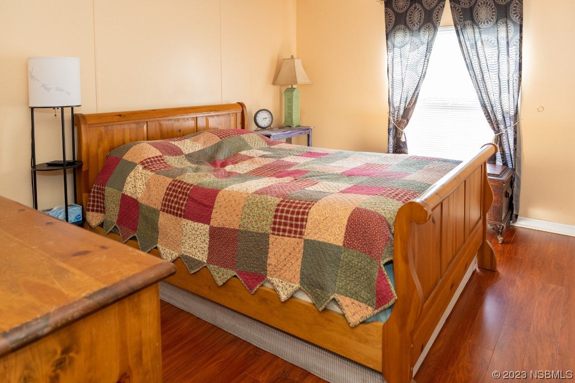 106 Charles Street Edgewater, FL 32141 - Photo 41 of 89 a bedroom with a bed and a window