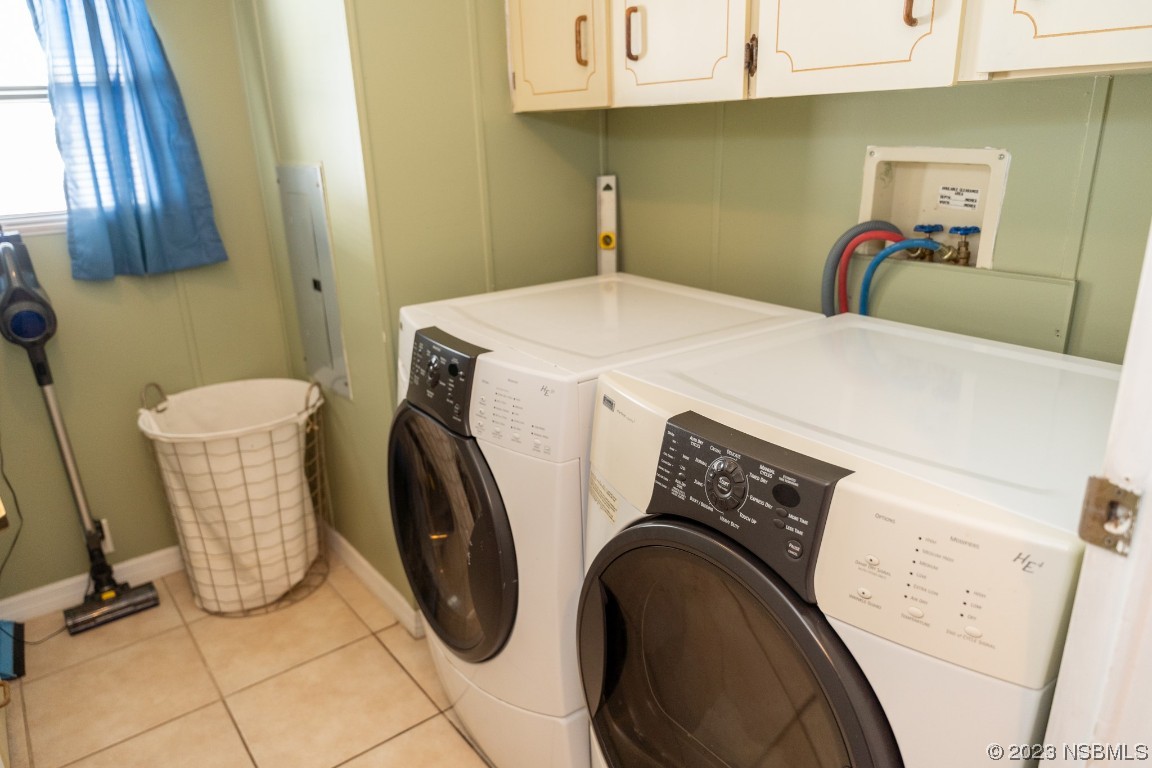 106 Charles Street Edgewater, FL 32141 - Photo 48 of 89 a utility room with dryer and washer