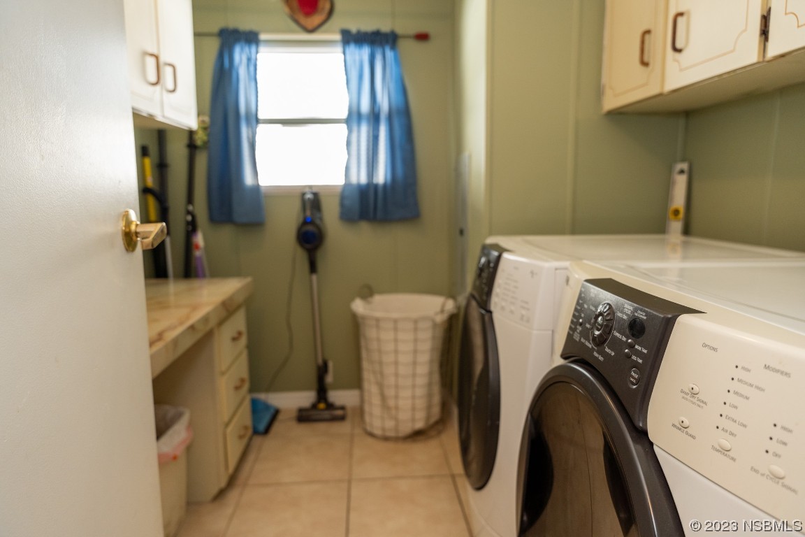 106 Charles Street Edgewater, FL 32141 - Photo 49 of 89 a utility room with dryer and washer