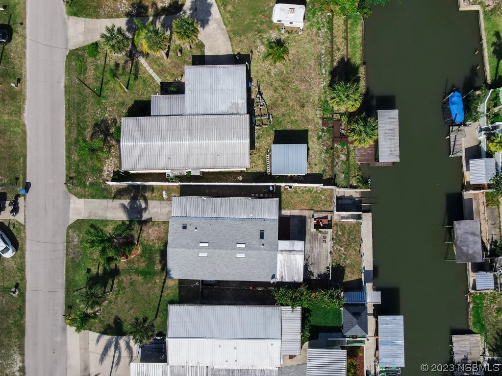 106 Charles Street Edgewater, FL 32141 - Photo 5 of 89 an aerial view of a house with a yard