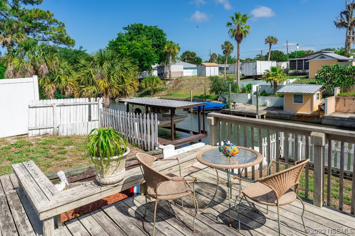 106 Charles Street Edgewater, FL 32141 - Photo 57 of 89 a view of a balcony with furniture and a garden