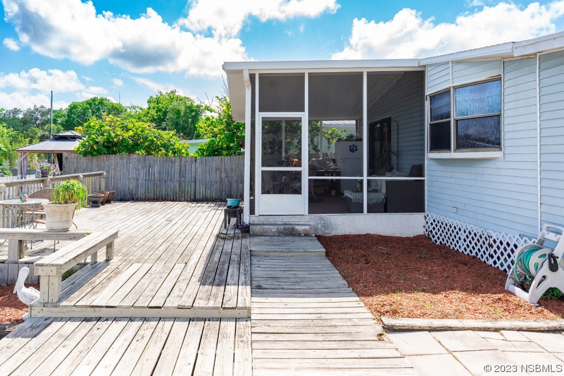106 Charles Street Edgewater, FL 32141 - Photo 59 of 89 a view of a wooden deck