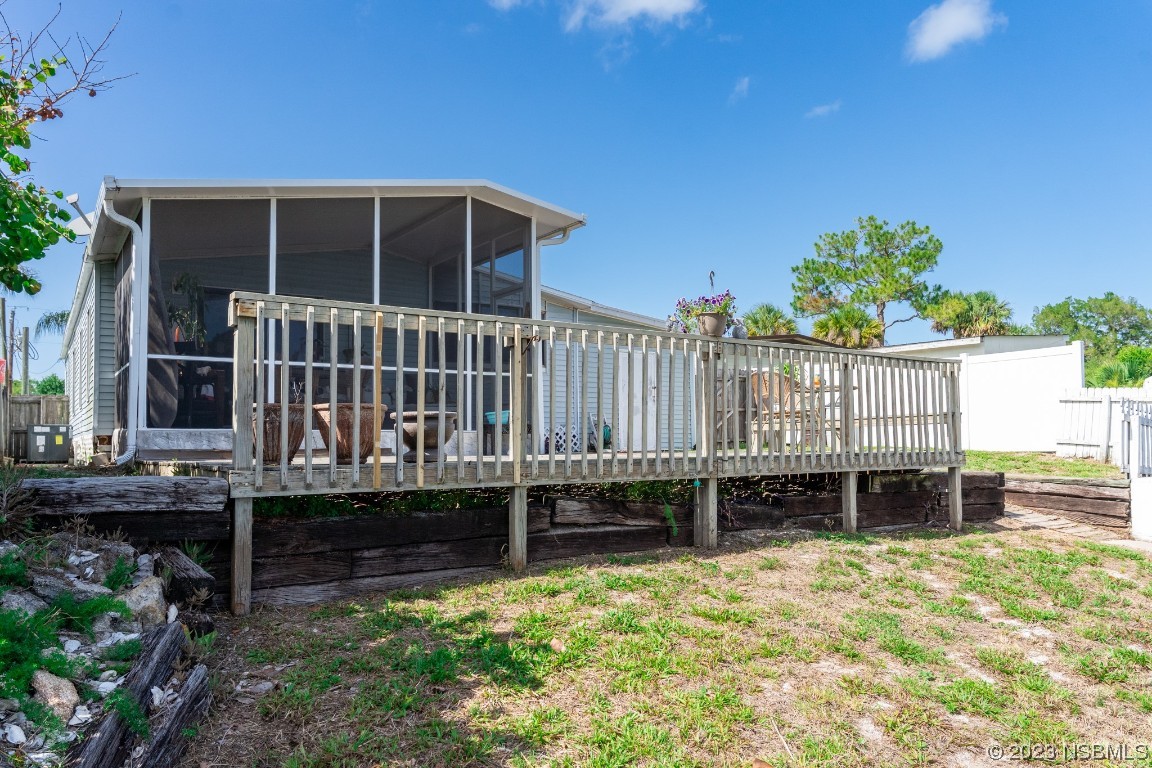 106 Charles Street Edgewater, FL 32141 - Photo 62 of 89 a view of a deck with a big yard