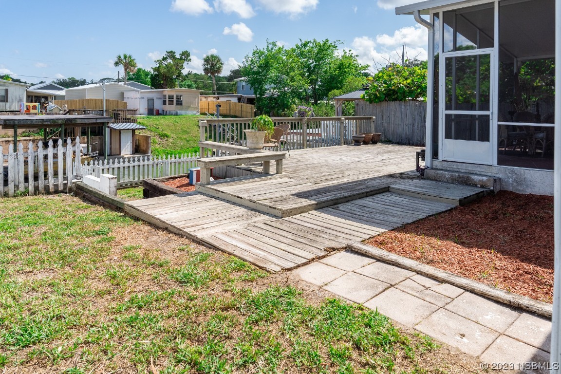 106 Charles Street Edgewater, FL 32141 - Photo 65 of 89 a view of a house with backyard and sitting area