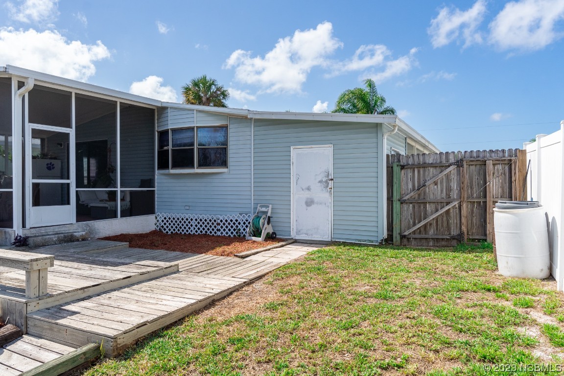 106 Charles Street Edgewater, FL 32141 - Photo 66 of 89 a view of a backyard of the house