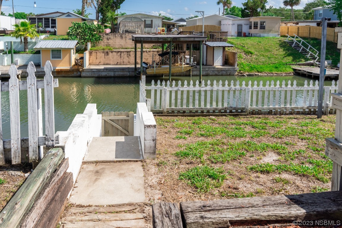 106 Charles Street Edgewater, FL 32141 - Photo 70 of 89 a view of a house with pool and chairs