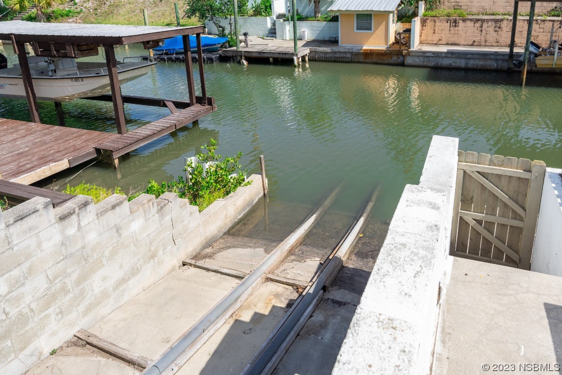 106 Charles Street Edgewater, FL 32141 - Photo 73 of 89 a view of wooden balcony with outdoor space