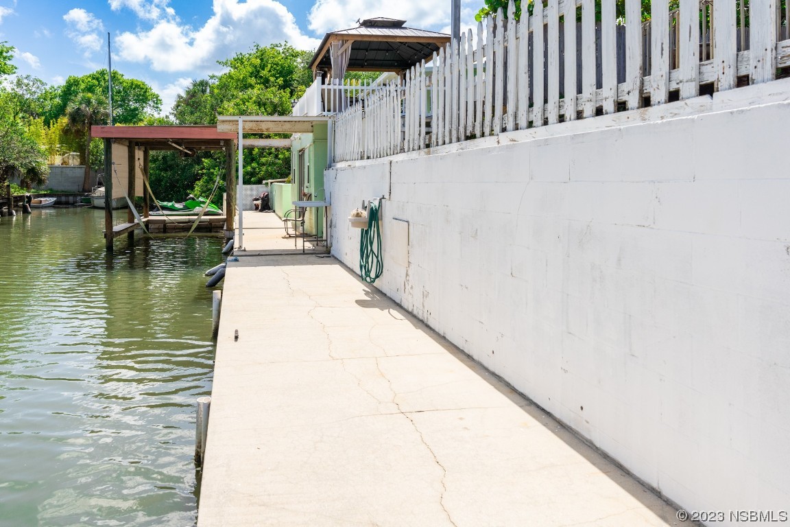 106 Charles Street Edgewater, FL 32141 - Photo 76 of 89 a balcony view with a garden