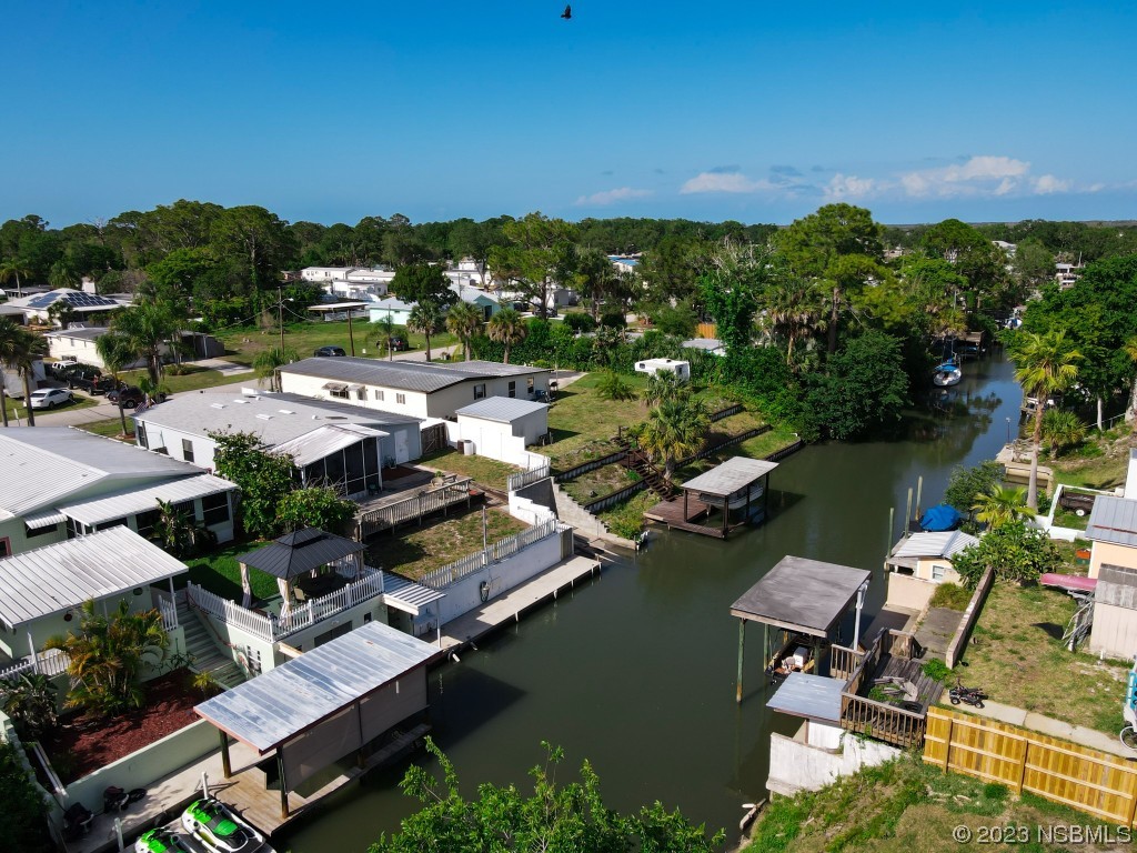 106 Charles Street Edgewater, FL 32141 - Photo 79 of 89 an aerial view of a house with a lake view
