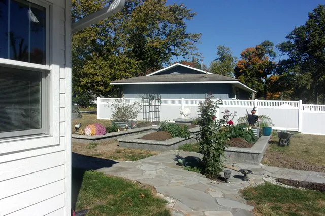 a view of a swimming pool with a yard