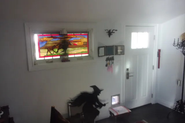 a view of an entryway with wooden floor