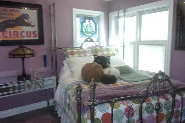 a room with furniture and painting on the wall