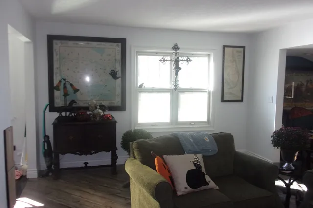 a kitchen with a sink a window and cabinets