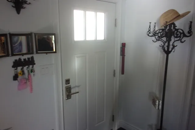 a bathroom with a glass shower door and a sink