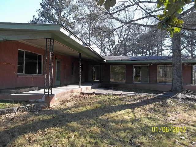 3310 Cave Spring Road Southwest Rome, GA 30161 - Photo 1 of 1 a view of a house with a tree in front of it