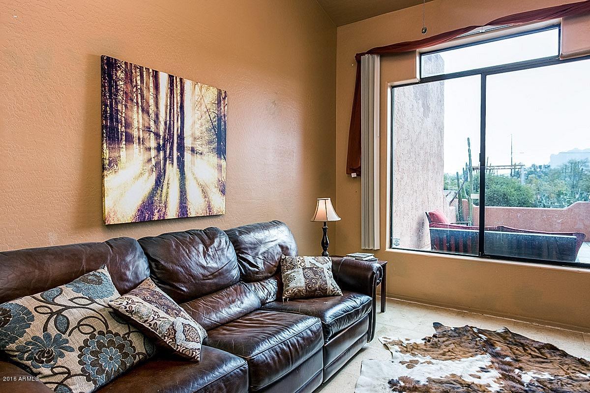 4180 North Wolverine Pass Road Apache Junction, AZ 85119 - Photo 5 of 17 a living room with furniture and a large window